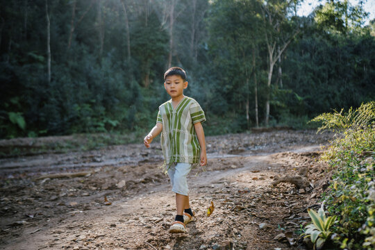 An Asian Boy Exploring the Forest and Stream in Northern Thailand