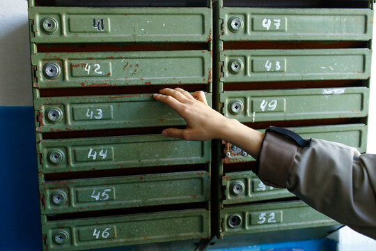 woman checking mailbox