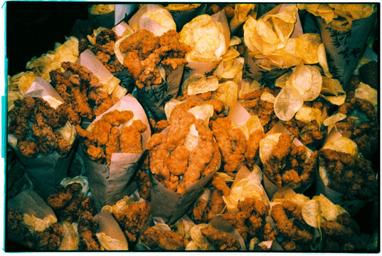 chicken strips and chips at a street food stall, 35mm film