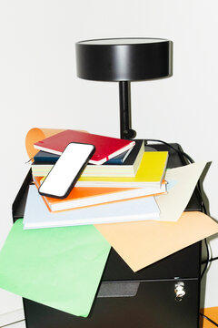 Phone mockup with empty screen for text or design on a office desk