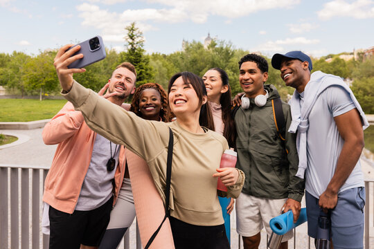 Friends taking selfie during outdoor workout session