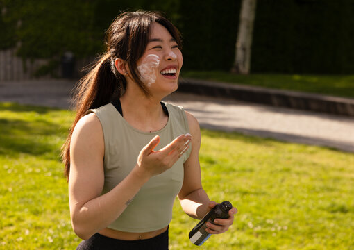 Young Asian woman enjoying outdoor workout session