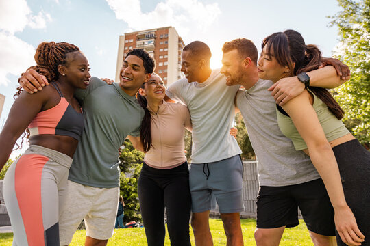 Multiethnic friends enjoying outdoor workout in Madrid