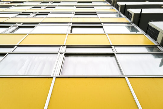 Looking up at the Yellow Panels of The Golden Lane Estate