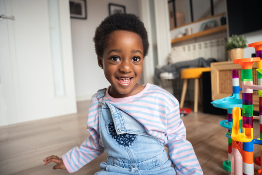 Happy african american girl smiling at home