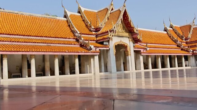 Radiant temple yard featuring polished surface and white pillars