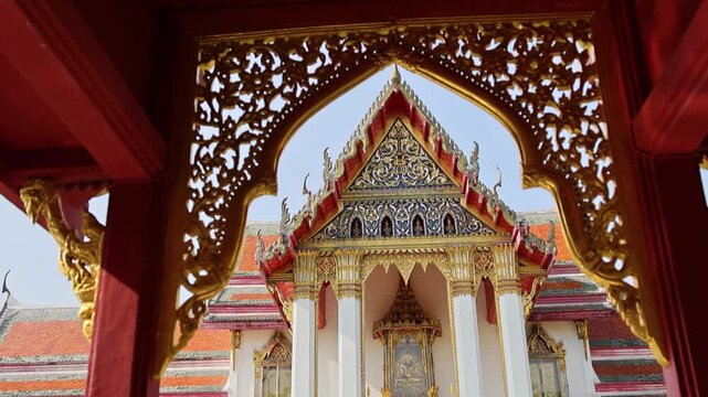 Exquisite decorated Thai shrine illuminated by early morning hues of dawn