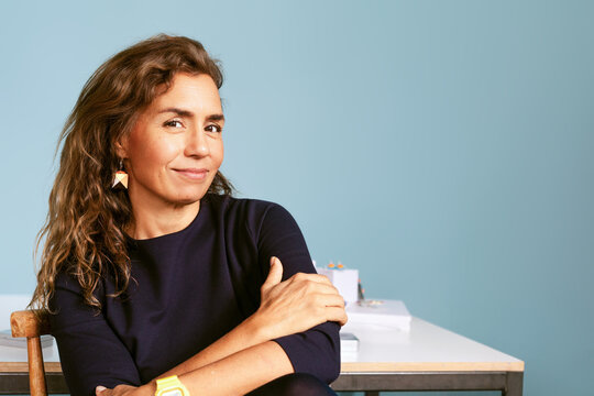 Woman at Desk With Warm Smile Studio