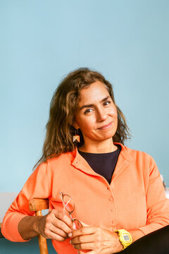 Woman Sitting Holding Glasses Portrait