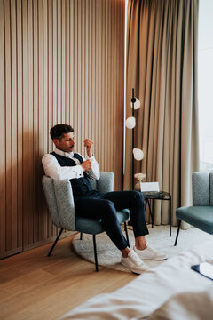 Man adjusting cufflinks during preparation