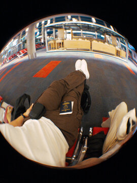Waiting at the Airport With a Passport and Relaxed Posture