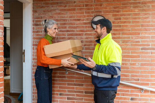 Senior woman receiving delivery