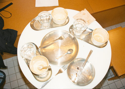 Dirty silverware arranged on a serving tray