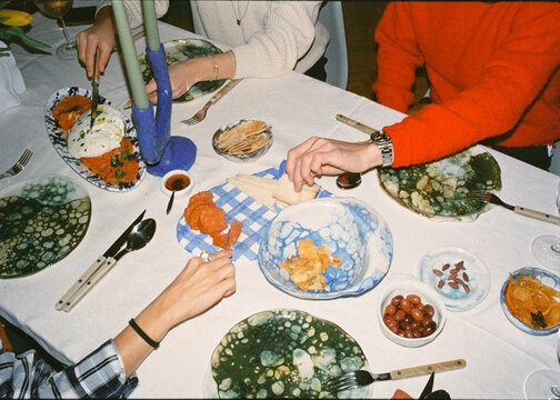 A group of anonymous friends enjoying appetizers