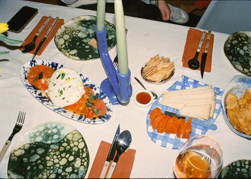 Analog-style shot, illuminated with direct flash, of an arranged table