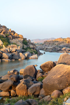 Rocky river landscape in Hampi, India at golden hour