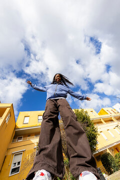 woman smiling at camera. View from below Super wide angle