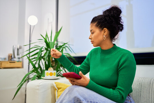 Woman relaxing waiting with tea at beauty salon