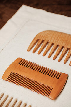 Wooden Combs Arranged on Fabric Surface for Display