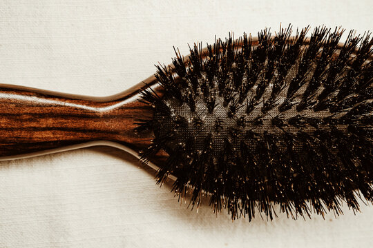 Hair Brush on a Light Surface in a Simple Setting