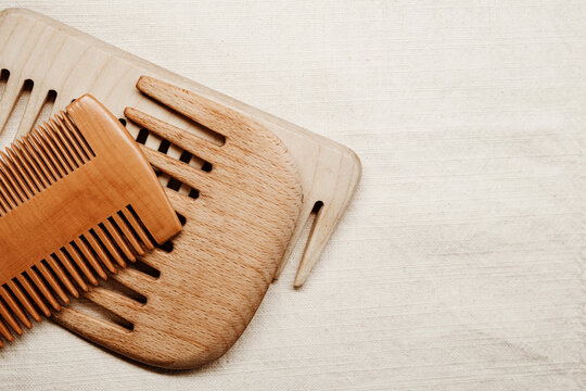 Wooden Combs Arranged on Fabric Surface for Display