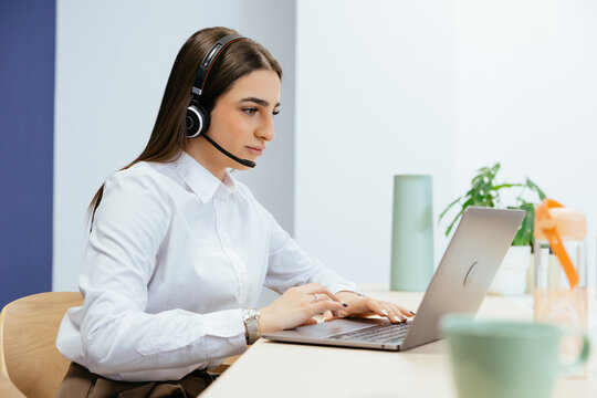 Woman working on laptop for customer support service