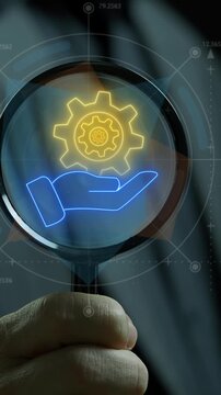 Concept for teamwork, target, motivation, mission, achievement, growth and success business. Manifying glass focus on animation of neon line human hand holding cogwheels icon.