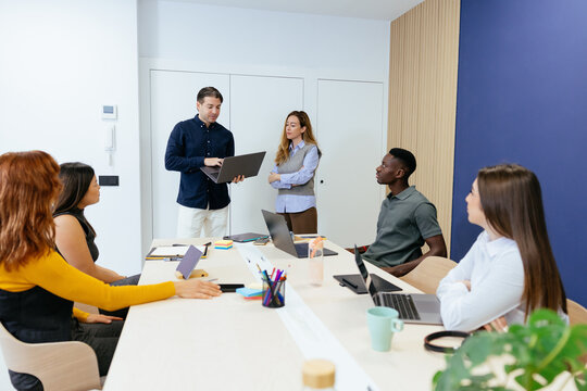 Diverse startup team collaborating during an office meeting