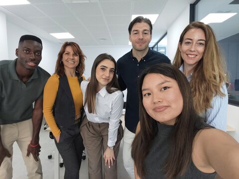 Diverse team creating user generated content in office