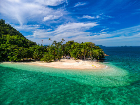 Aerial view of the pristine white sand beach and turquoise waters of Ko Rayang Nok island surrounded by lush tropical vegetation Ko Mak, Trat, Thailand.