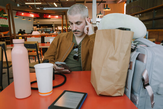 Man in airport restaurant
