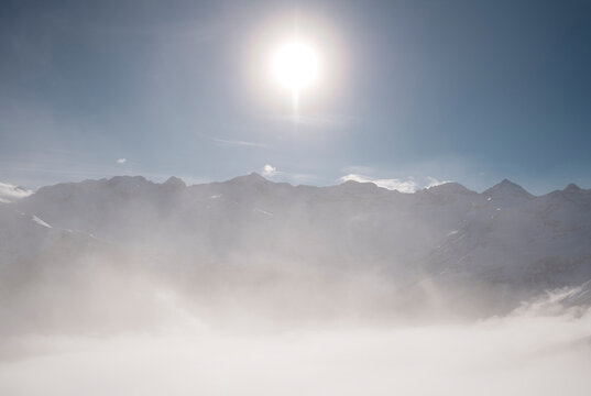  Blazing Sun Over a Misty Alpine Panorama