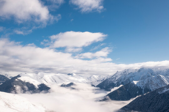 Scenic snowy valley view during sunny day