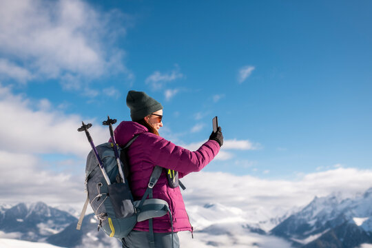 Happy Hiker Capturing the Mountain View with phone
