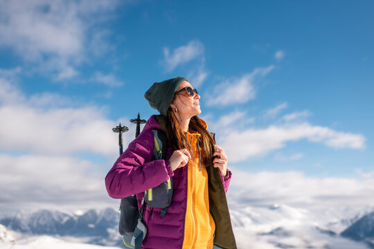 Pleased mountaineer Breathing pure air 