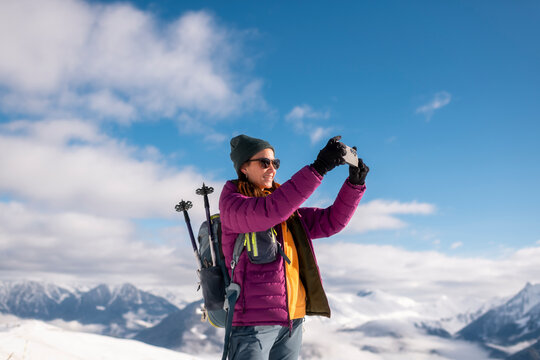 Triumphant Hiker Taking a Selfie on a Snowy Summit