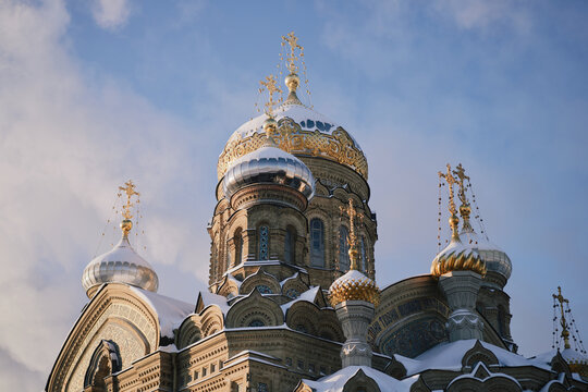 Snow-Covered Russian Orthodox Cathedral With Golden Onion Domes