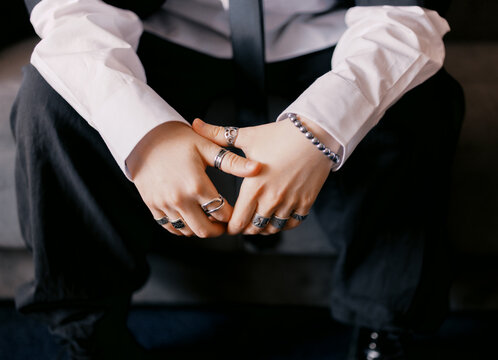 Hands With Rings Shown in a Well-Lit Indoor Space
