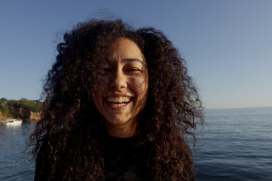 Portrait of a young woman at the sea