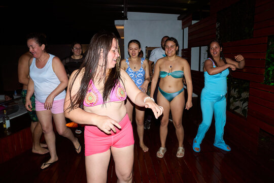 Group of women dancing enjoying a summer night party