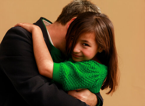 Father and Daughter Share a Hug 