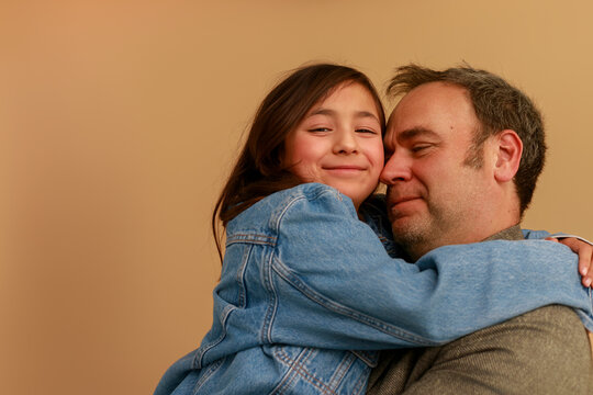 Father Holds Daughter 