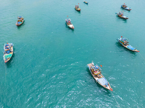 Vietnamese fishing boats at anchor on a turquoise sea