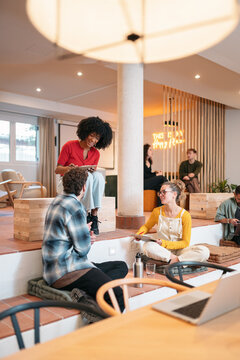 Diverse team collaborating in a modern coworking space