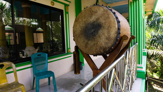A bedug (beduk) is a musical instrument used for religious communication. In Indonesia, the bedug is typically used to signal the arrival of prayer times. It is typically made from cow or buffalo hide