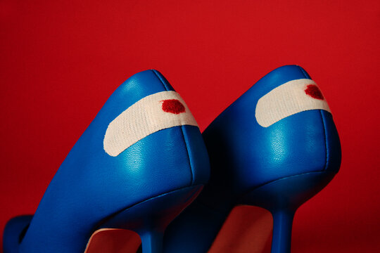blue high heel shoes with blood stained bandages