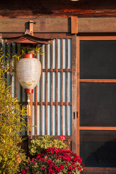 Traditional Japanese home with paper lantern and flowers