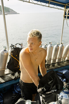 Male Diver Packing Gear After Dive Koh Tao, Thailand