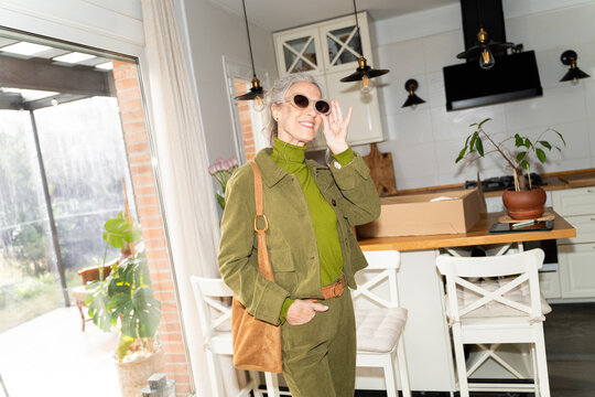 Senior woman posing for social media