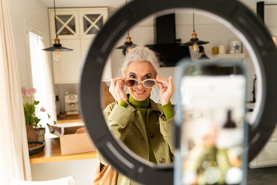 Senior recording fashion vlog